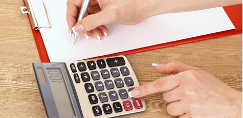 Tax Information Woman with calculator and note pad